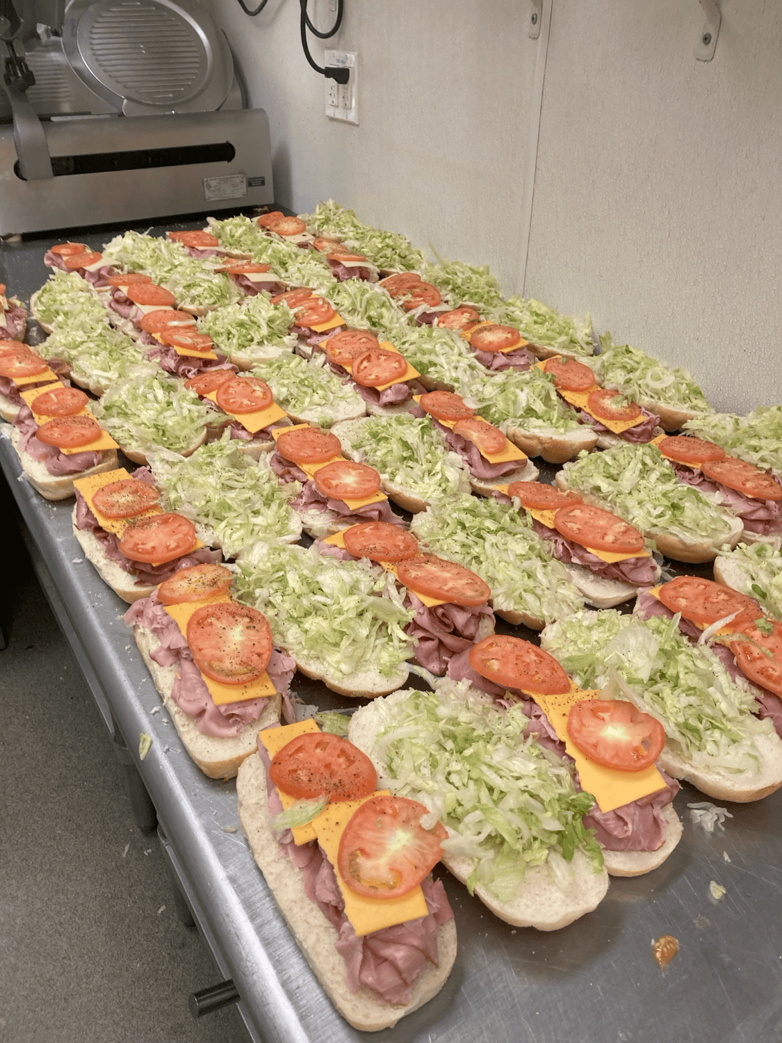 sandwiches laid out for a large catering event
